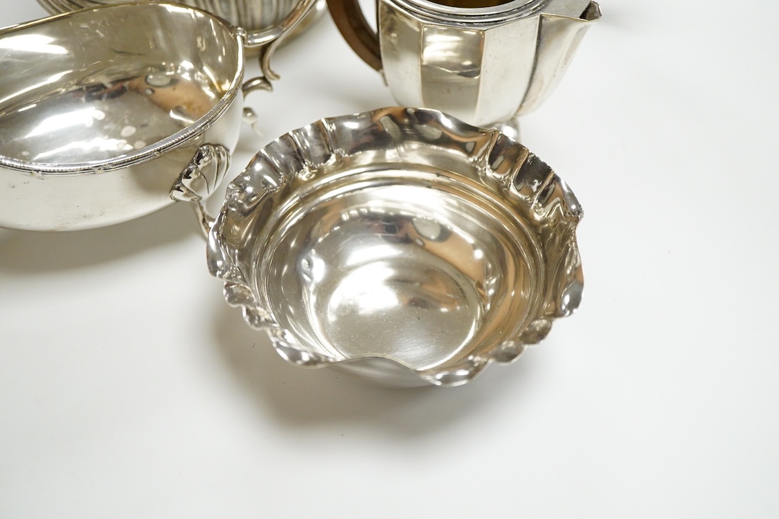 A 20th century continental 800 standard white metal hot water pot and cream jug (lacking cover and knop), gross weight 11.2oz, together with a plated teapot, sauceboat and bowl.